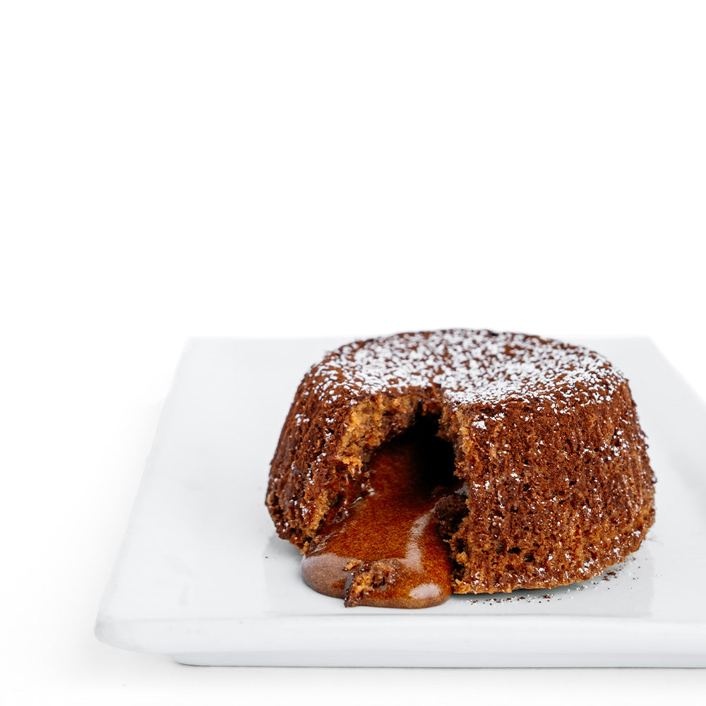 Ginger Elizabeth Chocolates Molten souffle dessert on square white plate on white background