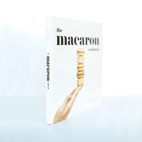 The Macaron Cookbook angled from binding edge on white background